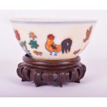 A Chinese Ming style Doucai porcelain chicken cup decorated with enamel chicken, chicks and foliage,