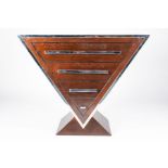 A late 20th century reproduction Art Deco style hardwood chest of triangular form, with four
