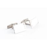 A pair of platinum and diamond cufflinks of rectangular form, fully hallmarked to face and inset