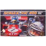 Two boxed Scalextric 400 Electric Racing Sets (one lacking cars), with track, paperwork and