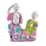 A Chinese Qianlong period famille rose ceramic group of the Hehe Erxian Twins symbolising “harmony