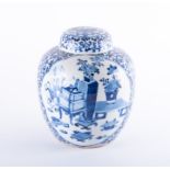 A 19th century Chinese blue and white ginger jar and cover decorated with two opposing reserves