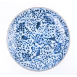 An 18th century Chinese blue and white porcelain plate probably late Kangxi, with floral pattern