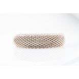 Tiffany & Co. A silver mesh bracelet internal diameter approximately 6 cm.