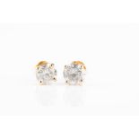 A pair of round brilliant-cut diamond ear studs of approximately 1.0 carat combined, approximate