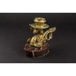 A 19th century French gilt bronze chamber stick on marble base circa 1830, modelled as a man with