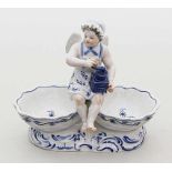 Figürliche Doppelsaliere, Meissen.Auf zwei Muscheln als Gewürzschalen sitzender, weiblicher Putto