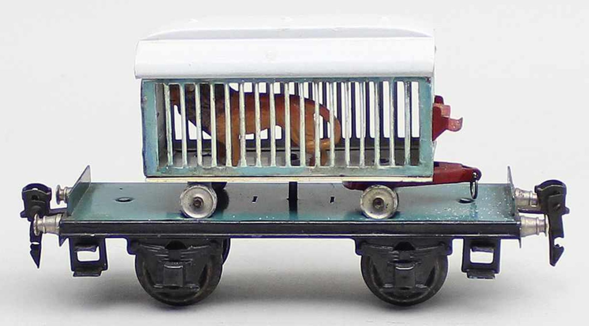 Plattformwagen, Märklin, Spur 0.Art.-Nr. 1983/0, mit Löwenwagen ohne Aufschrift und Löwe. Blech,