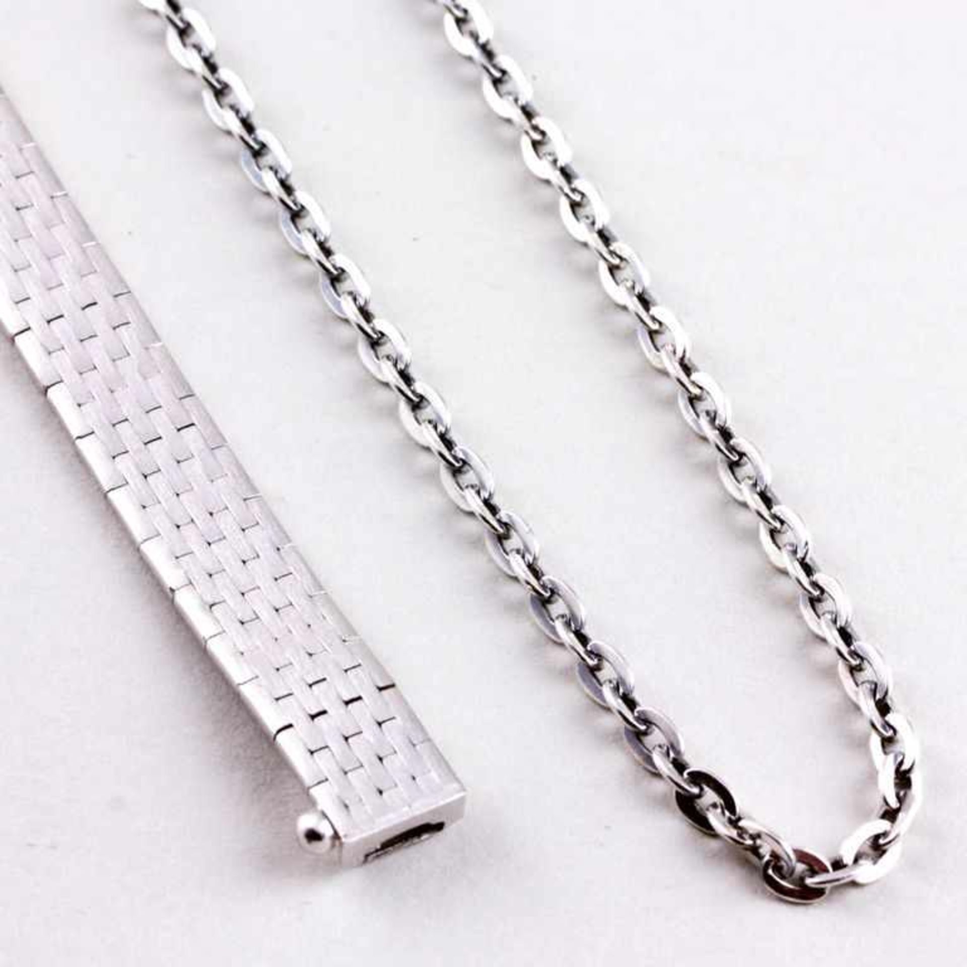 Flechtarmband und Ankerkette.835/000 Silber, 31 g. Armband mit satinierter Oberfläche, B. 0,8, L.