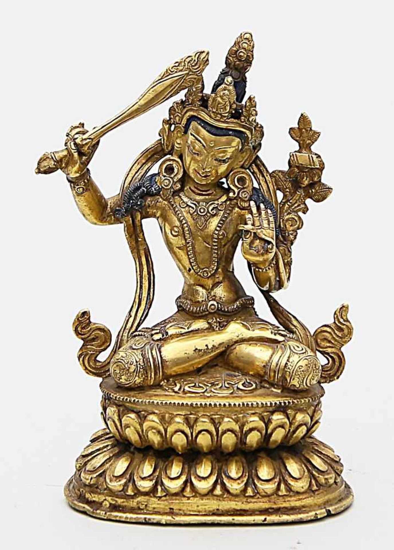 Skulptur des "Manjusri".Feuervergoldete Bronze, partiell geschwärzt. Die im Diamantsitz auf