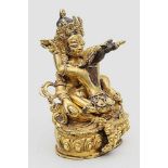 Skulptur einer tantrischen Gottheit im Yabyum.Zweiteilige, feuervergoldete Bronze. Die Gottheit