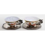 Sechs Teetassen mit Untertassen.Bunt bemalte Porzellankummen (Bemalung abweichend mit Drachen bzw.