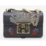 Seltene Henkeltasche "BORSA PADLOCK MOON PATCH", Gucci.Schwarzes Leder. Vergoldete