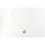 Geelgouden collier met bicolor gouden hartpendant bezet met diamant briljantslijpsel ca. 1.ct.