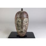 Houten gestoken Fang deels wit masker met spleetogen en gesloten mond, Gabon, l. 38 cm.Wooden carved