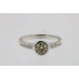 Witgouden ring bezet met diamant brijantslijpsel ca. 0.59ct., geh. 750/000 gew. 4.4gr. ringmaat 17