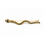 Gouden broche, begin 20e eeuw,in de vorm van een slang. Kop gezet met een ovale gefacetteerde