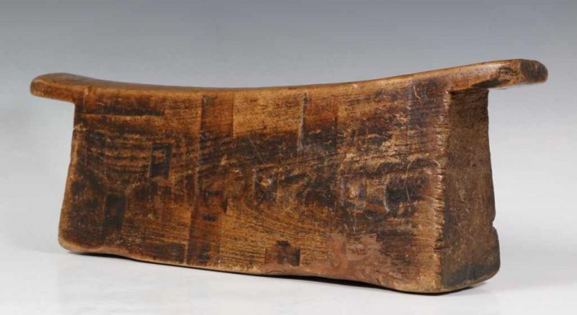 South Africa, Zulu, wooden neck rest with solid sloping base,burned and pressed geometrical patterns