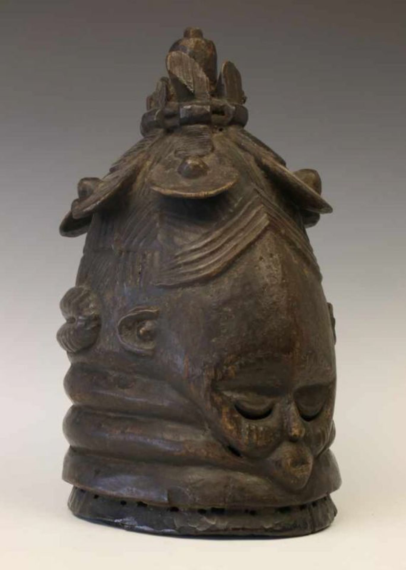 Siera Leone, Mende, Sowei mask,carved helmet mask with bound hair with seven tresses. With black
