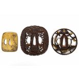 Japan, drie tsuba's, Edo periodetwee ajour met florale patronen en resten van vergulding en een