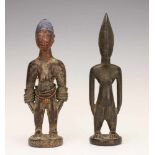 Yoruba, Oyo, male and female Ibeji figureFemale with bracelets and painted face and hair and old