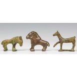 Three Middle East bronze animal figures, 1500 - 1000 BC.;three stylized horses.; 6 and 6,8 cm.;