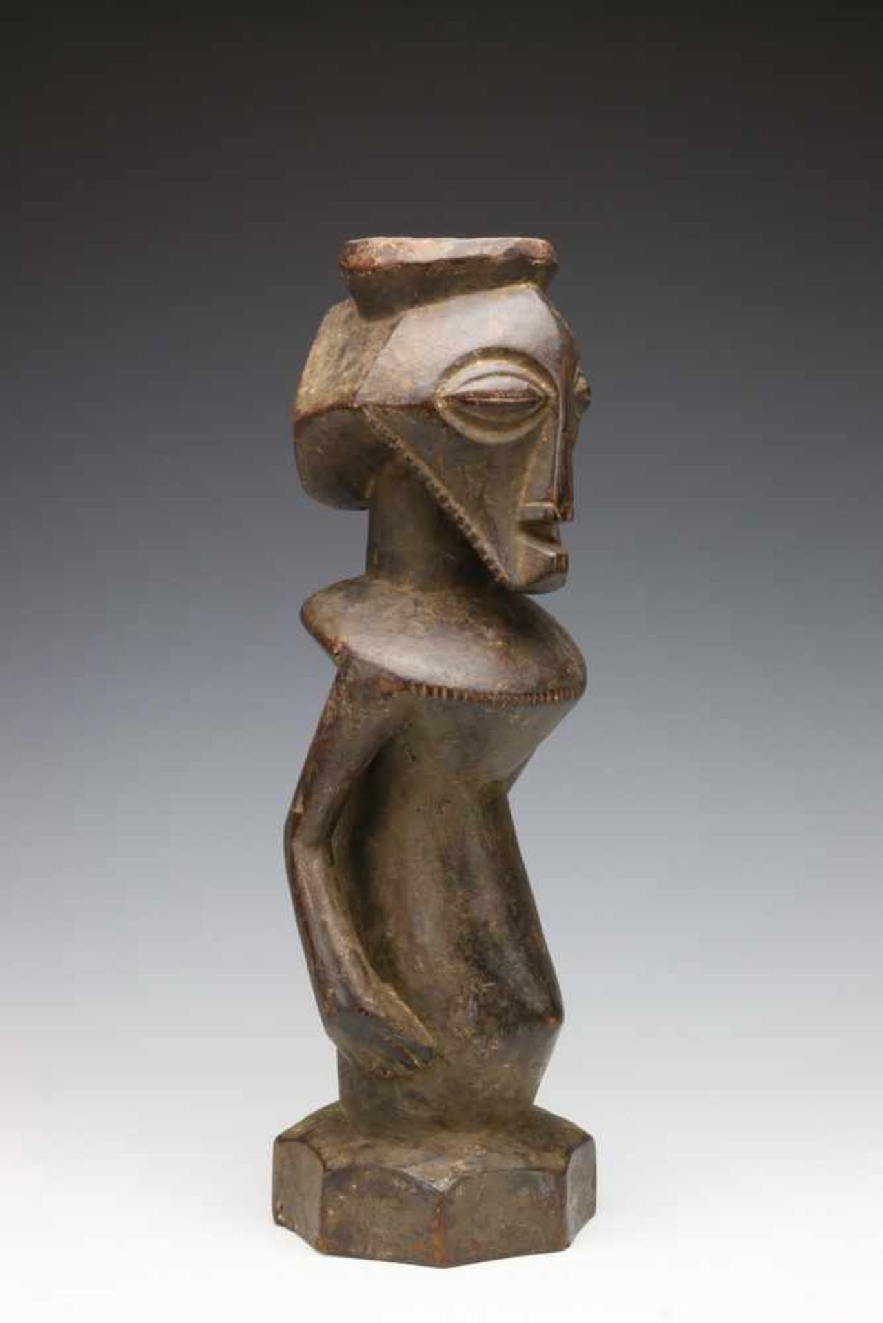 DRC., Bembe, half figure,with hole in head, beard, indentations round the shoulders and a base