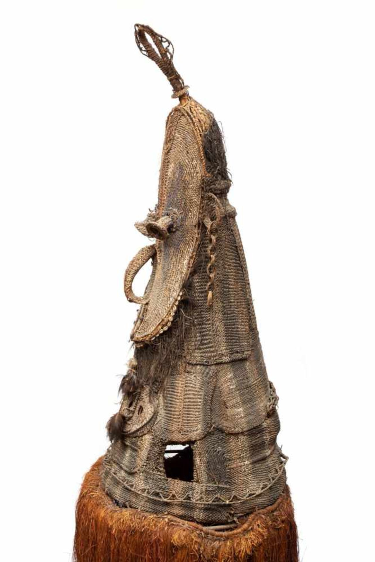PNG, Yatmul, plated rattan body mask with two heads, embellished with cowrie, feathers and plant