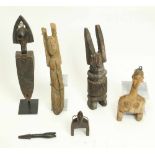 West Africa, six wooden objects, a.o. Bamana lock fragmentDogon figure with raised arms and a Lobi