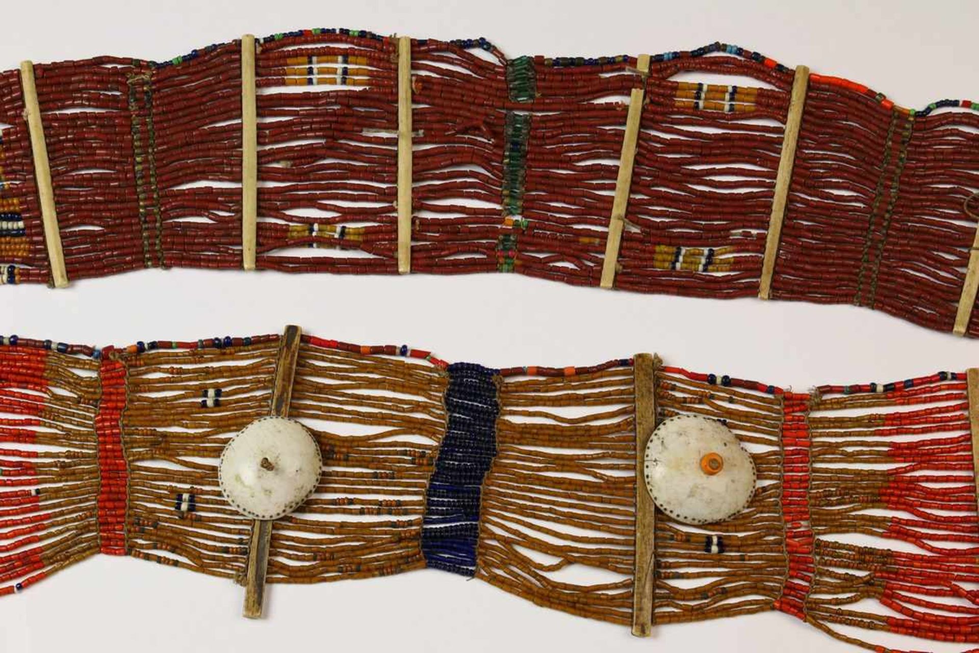 North East India, Naga, two beaded necklaces, ca. 1900,with shell ornaments and bone dividers. ;