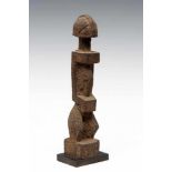 Mali, Dogon, standing anthropomorphic figure,carved in clear angular style and with layers of