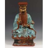 China, porseleinen vormstuk, 20e eeuw;Confucius, met iriserend bruin en turkoois glazuur; h. 44 cm.;