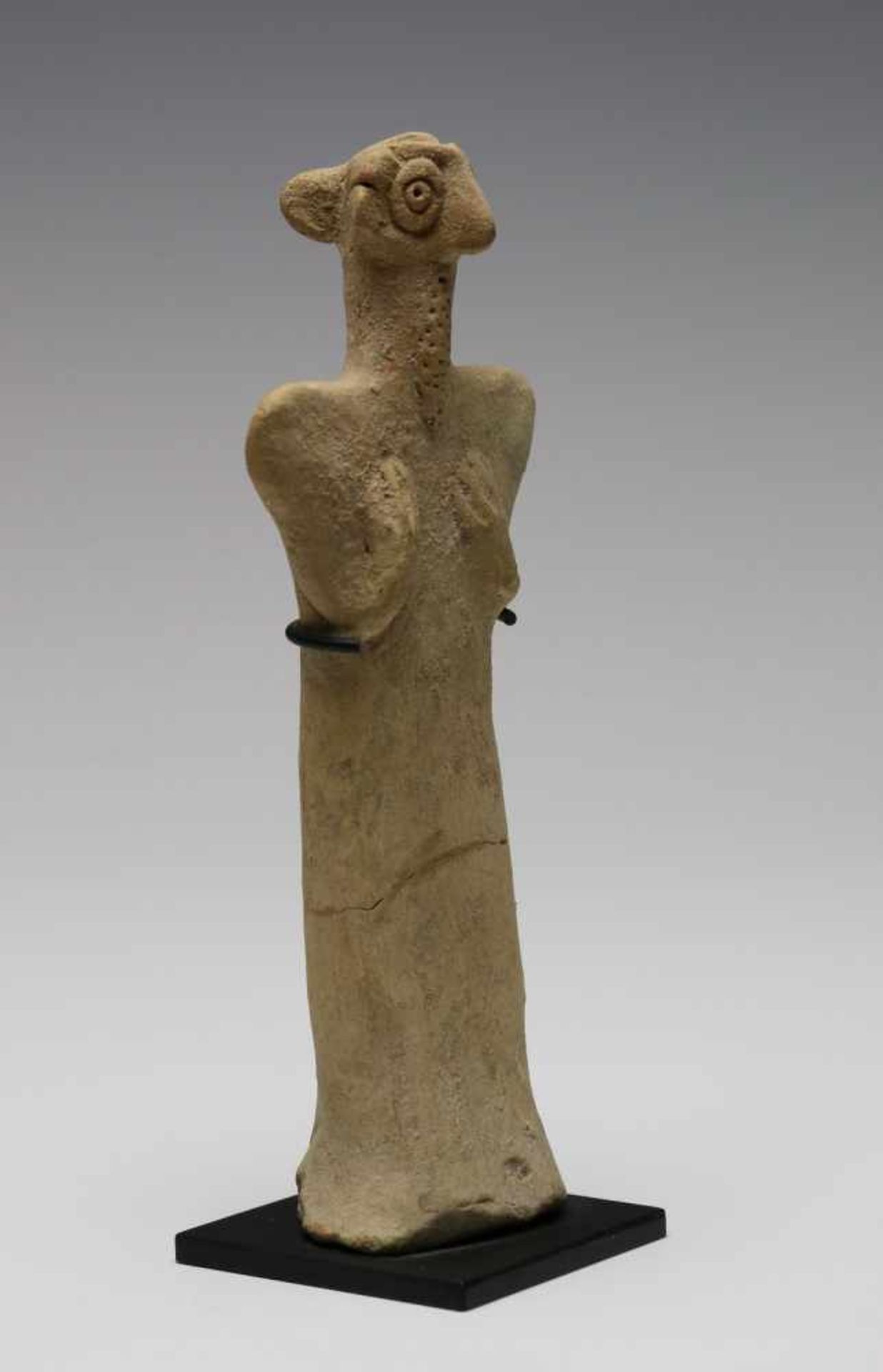 North Syria, terracotta idol, 2nd Mill BC.,with triangular shaped upper boddy, folded arms, beard