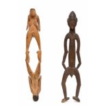 Papua Barat, Asmat, carved wooden male figure and male-female double figureProvenance: Private Dutch