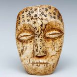 DRC Lega, ivory face mask, white colored ivory maskwith broad carved mouth, cowry shaped eyes and