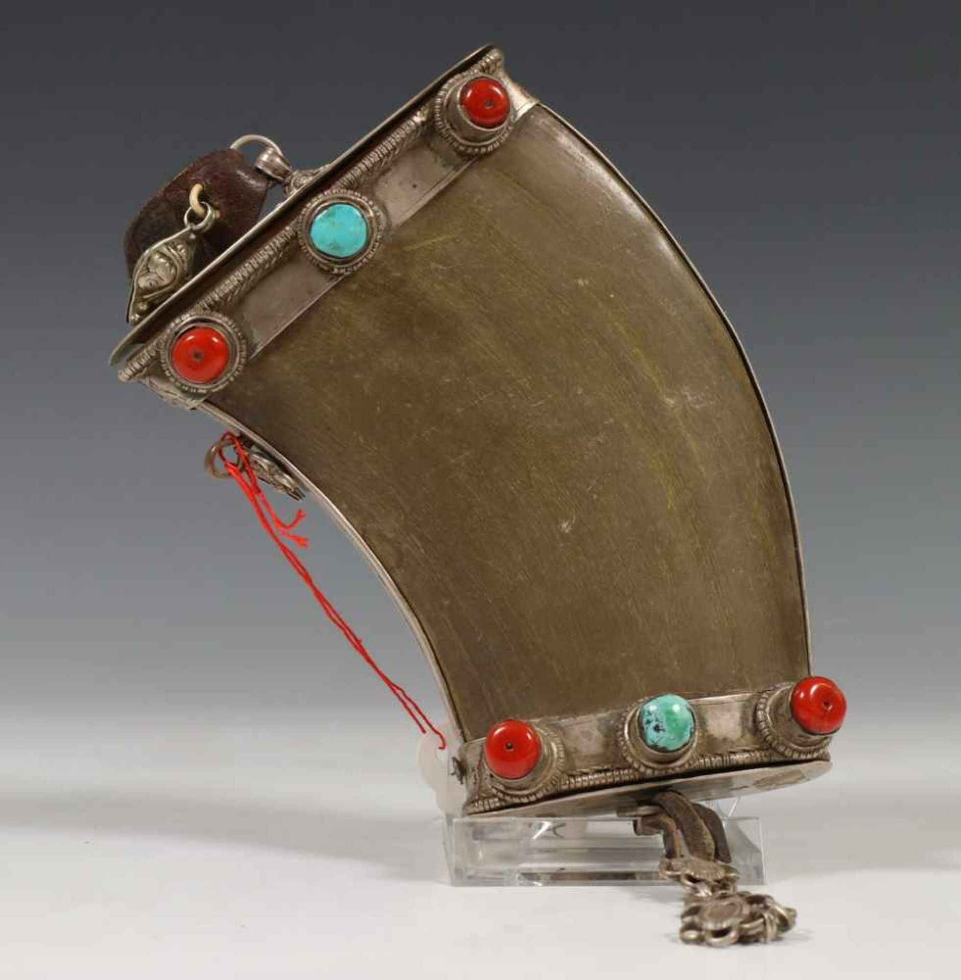 Tibet, powder horn, 19th century. Silver, wood, leather, horn, turquoise and coral.Opens at two