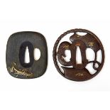 Japan, twee tsuba's, Edo Periode,een met in hoogreliëf afbeelding van bidsprinkhaan, gesigneerd