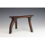 South Sudan, Dinka, wooden neckrest,with three curved legs. With glossy dark brown patina. Private