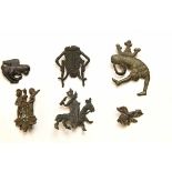 Collection of 5 tin-lead pilgrim amulets, ca. 15th century,on in the shape of a jumping vagina and