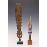 New Britain, wooden staffwith three carved prongs and blue, white and red pigments. With old