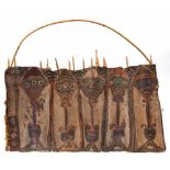 PNG, Washkuk, a rare, early 20th century, skull rack, consisting of six sago palm petioles,mounted