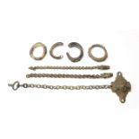 Sumatra, Toba Batak, brass ornament on a chain with Singha head, two loos chains with singha head