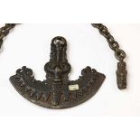 Sumatra, Toba Batak, brass fire starter, 19th century,and a loose chain with singha head.; h. 13