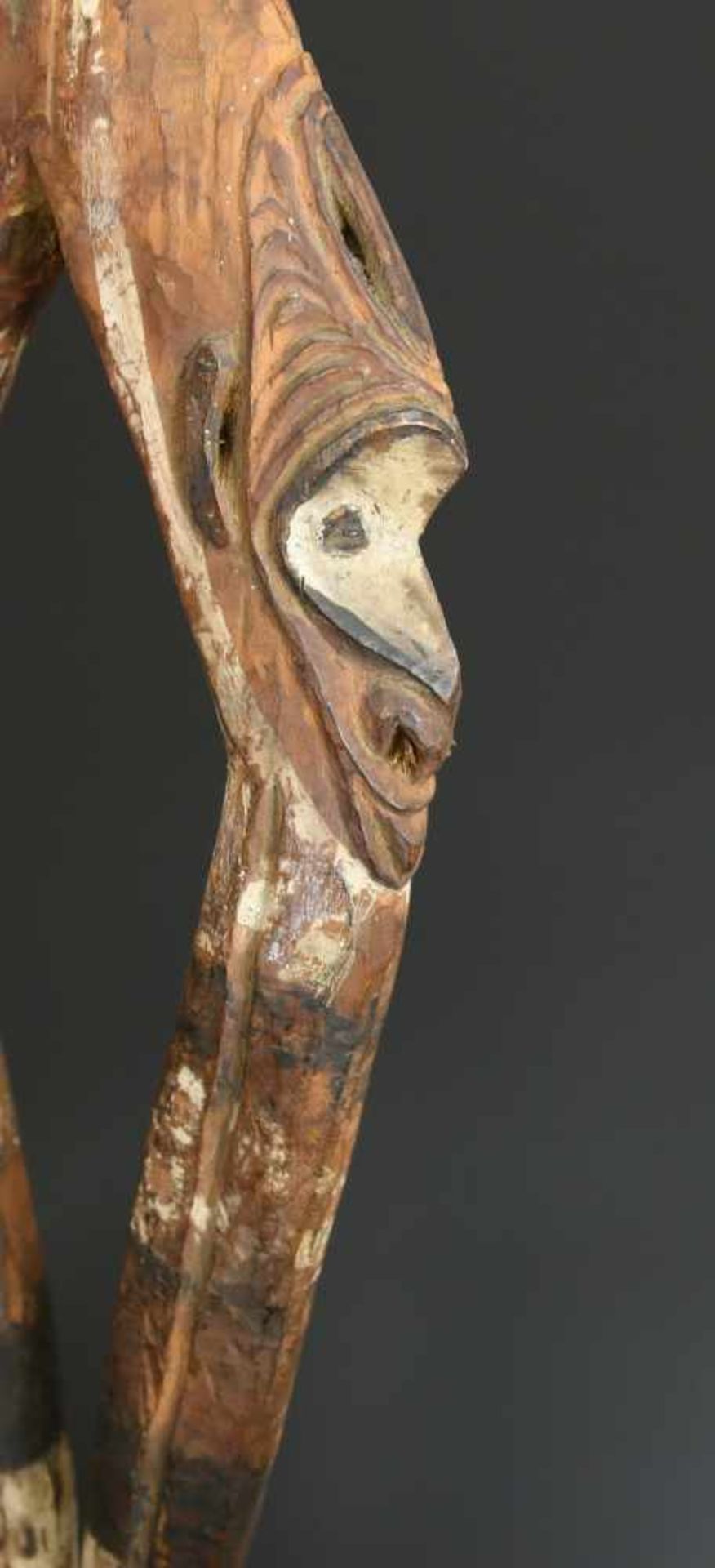 PNG, Middle Sepik, wooden suspension hook,showing two anthropomorphic faces on both sides of upper