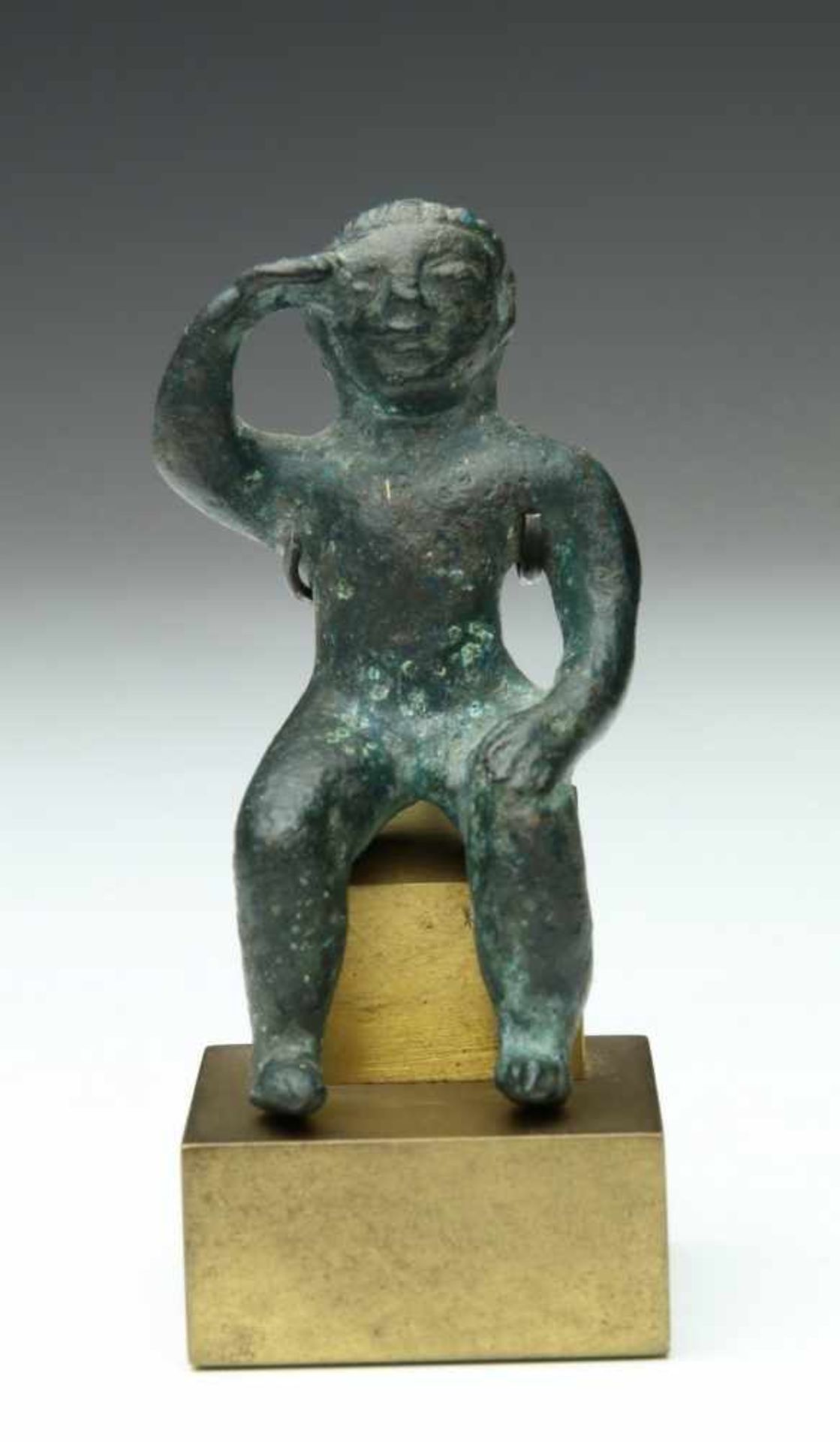 Antique bronze statue of a seated figure, possibly Roman.with on hand to his right temple.; h. 6,5