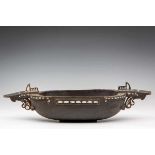 Solomon Islands, carved wooden ceremonial bowl, ca. 1900.the two handles carved in the form of two