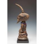 DRC., Songhe, halffigure,with horn, beaded necklaces, animal skins and remnants of offering. Ex