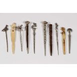 Tien pijpenwroeters, 19e eeuw,hout, been en zilver; 10200
