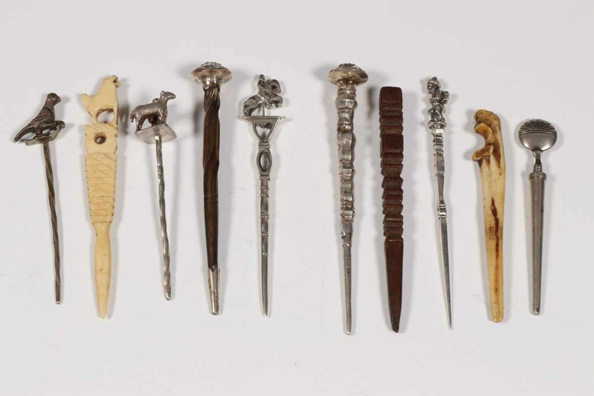 Tien pijpenwroeters, 19e eeuw,hout, been en zilver; 10200