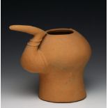 Persia, red terracotta jug, 1st Mil. BC,with a fine ridge over the back and a bent sprout in the